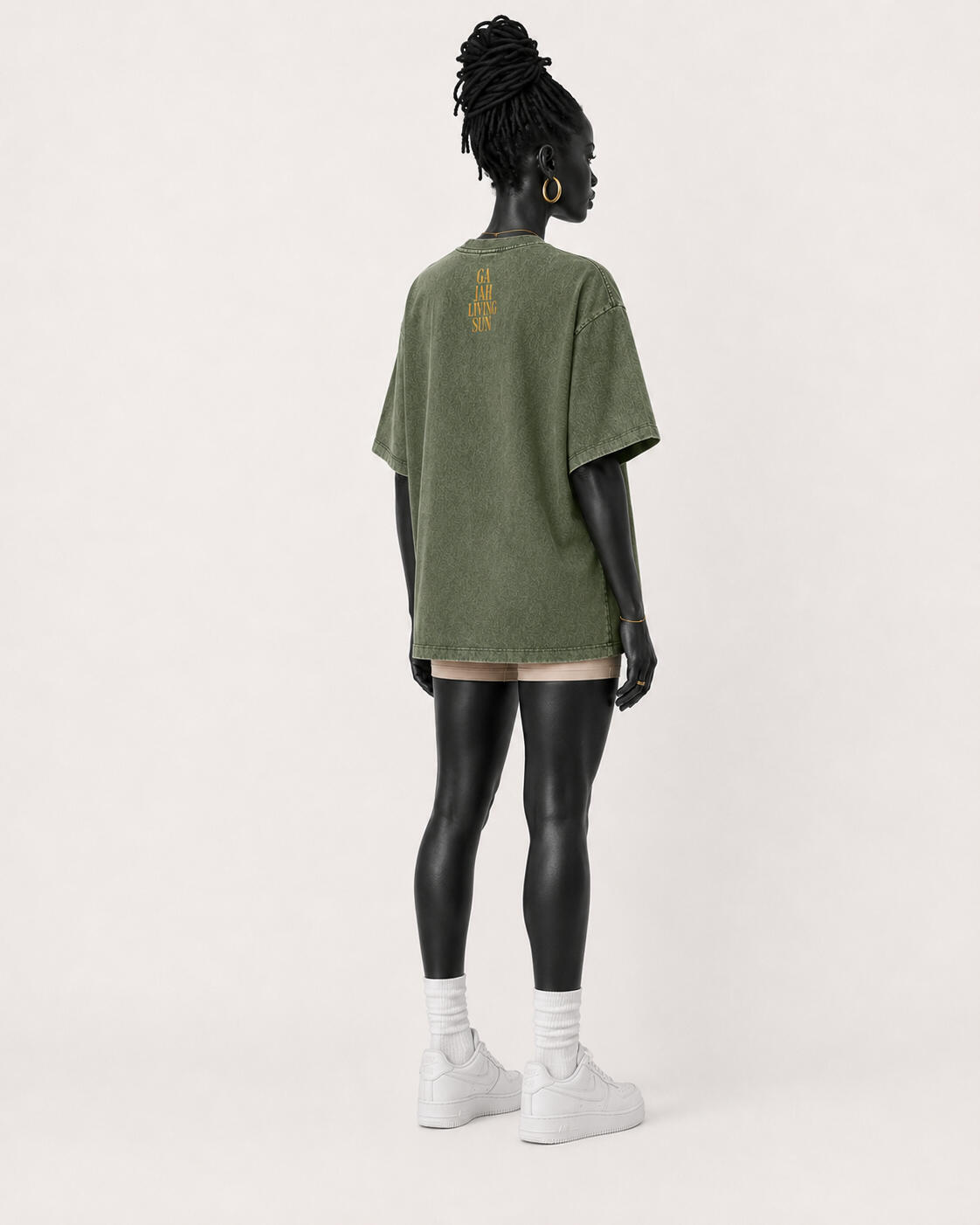 Purple Living Icon oversized tee worn by the approved matte-black female mannequin, front view.